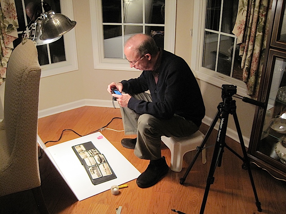 Chuck photograghing the albums.